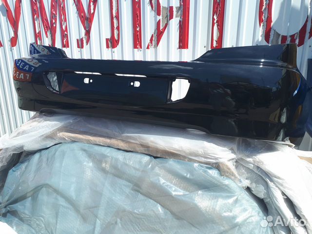 Бампер задний Kia Spectra В цвет авто /676 черный