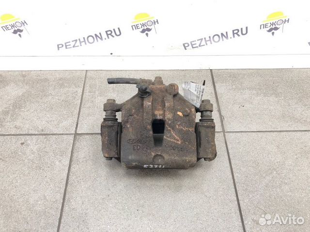 Суппорт тормозной передний левый Kia Ceed хэтчбек