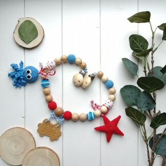 Вязанная растяжка для коляски или кроватки